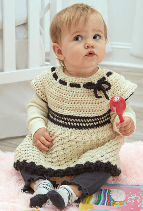 Baby tunic laid flat showing yoke and bodice